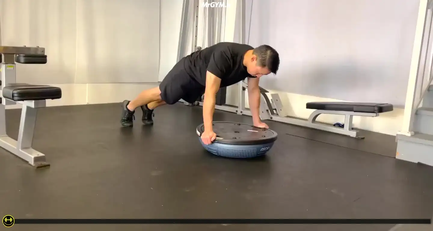 آموزش حرکت شنا دست باز روی نیم کره تعادلی (Balance Trainer Wide Pushups)