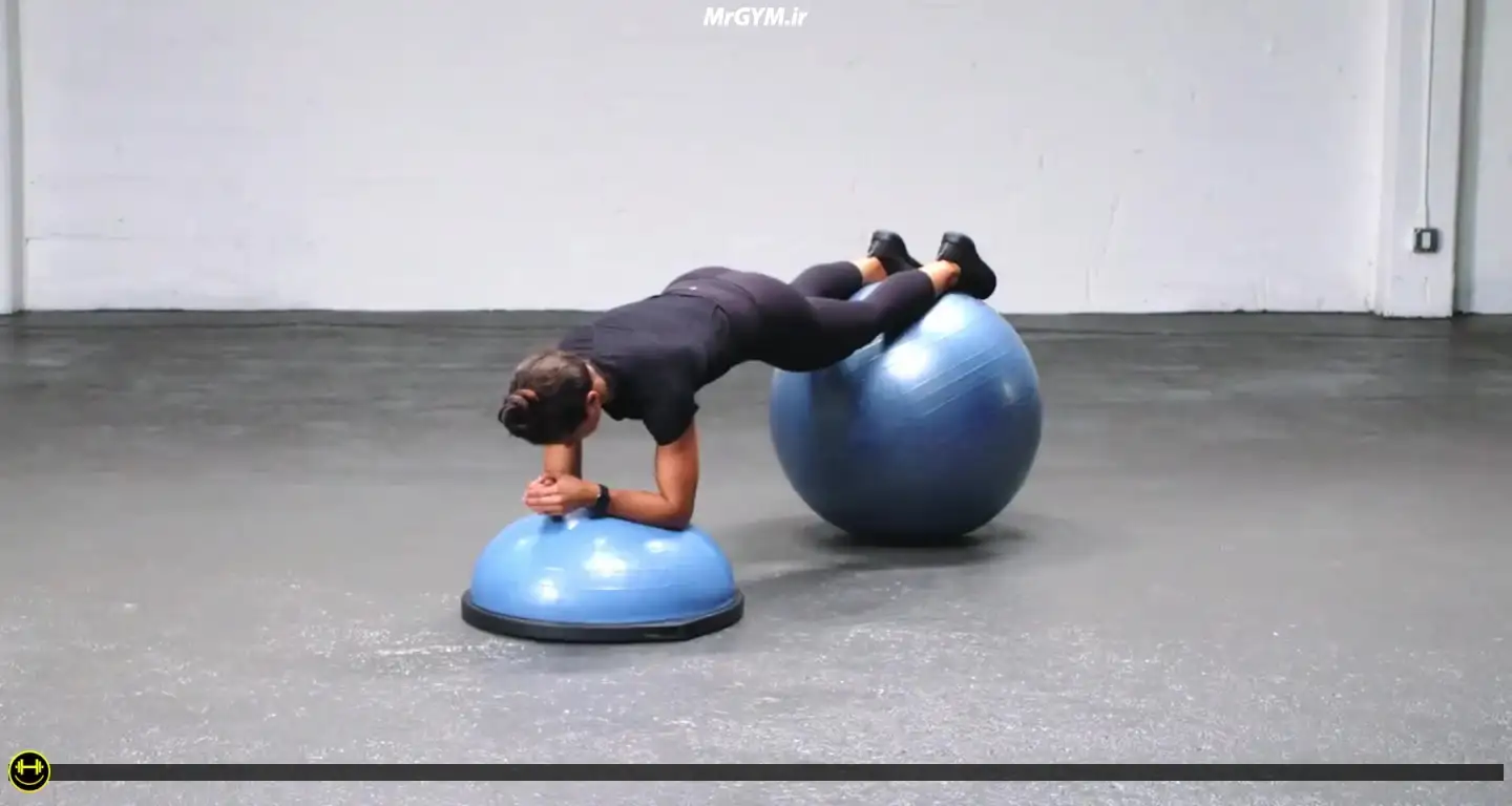 آموزش حرکت پلانک با توپ تعادلی روی نیم کره (Stability Ball Plank on Balance Trainer)