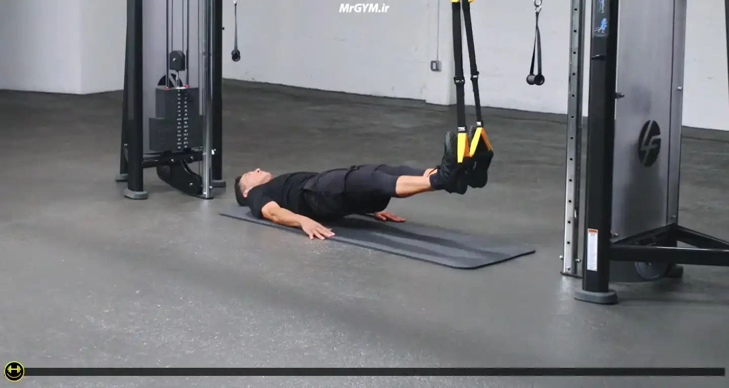 آموزش حرکت جمع کردن پشت ران متناوب با TRX (TRX Alternating Hamstring Pull-In)